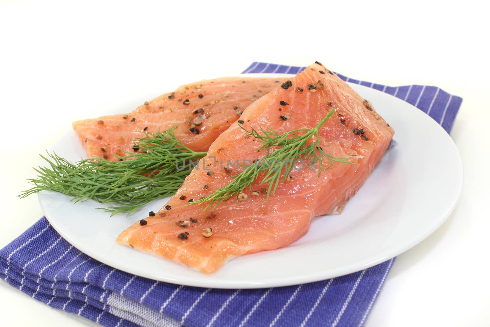 two raw pieces of salmon with dill