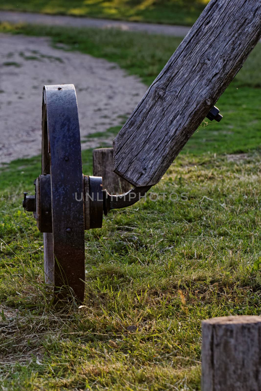 Old wagon wheels on a wooden column