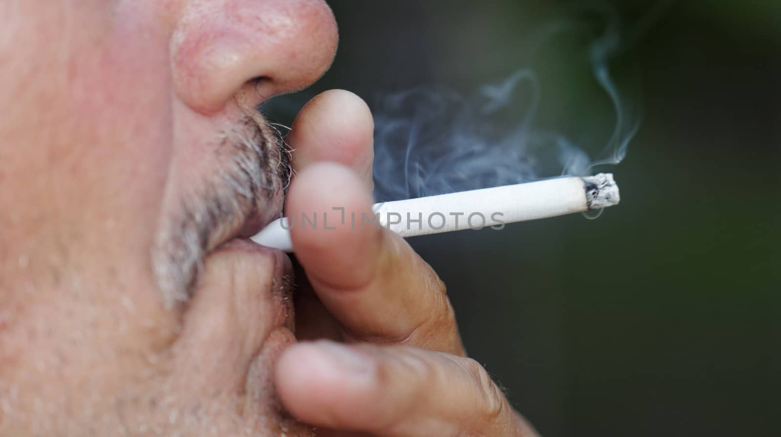 Man smoking a cigarette by NagyDodo