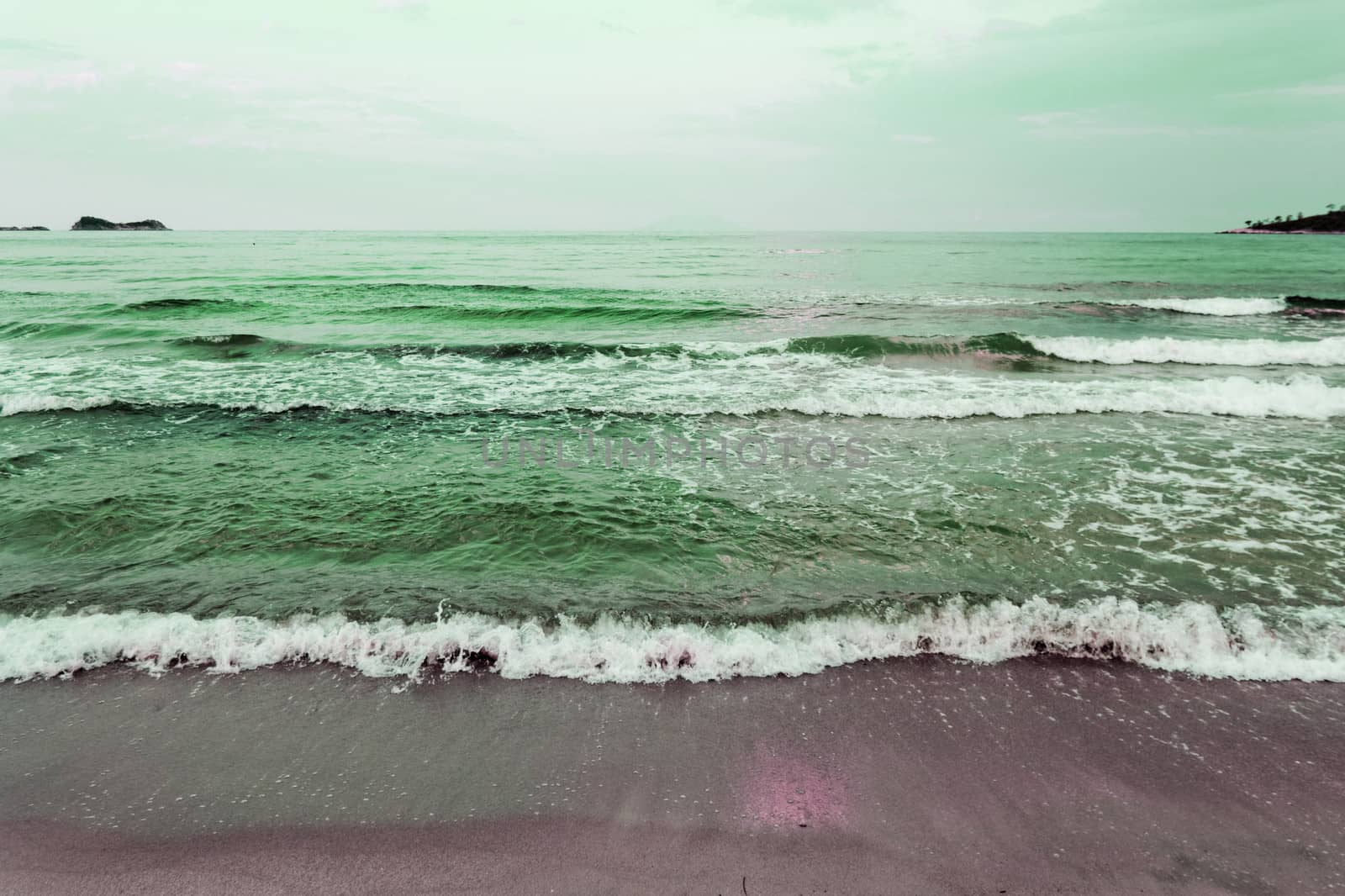 waves of sea on the sandy beach by NagyDodo
