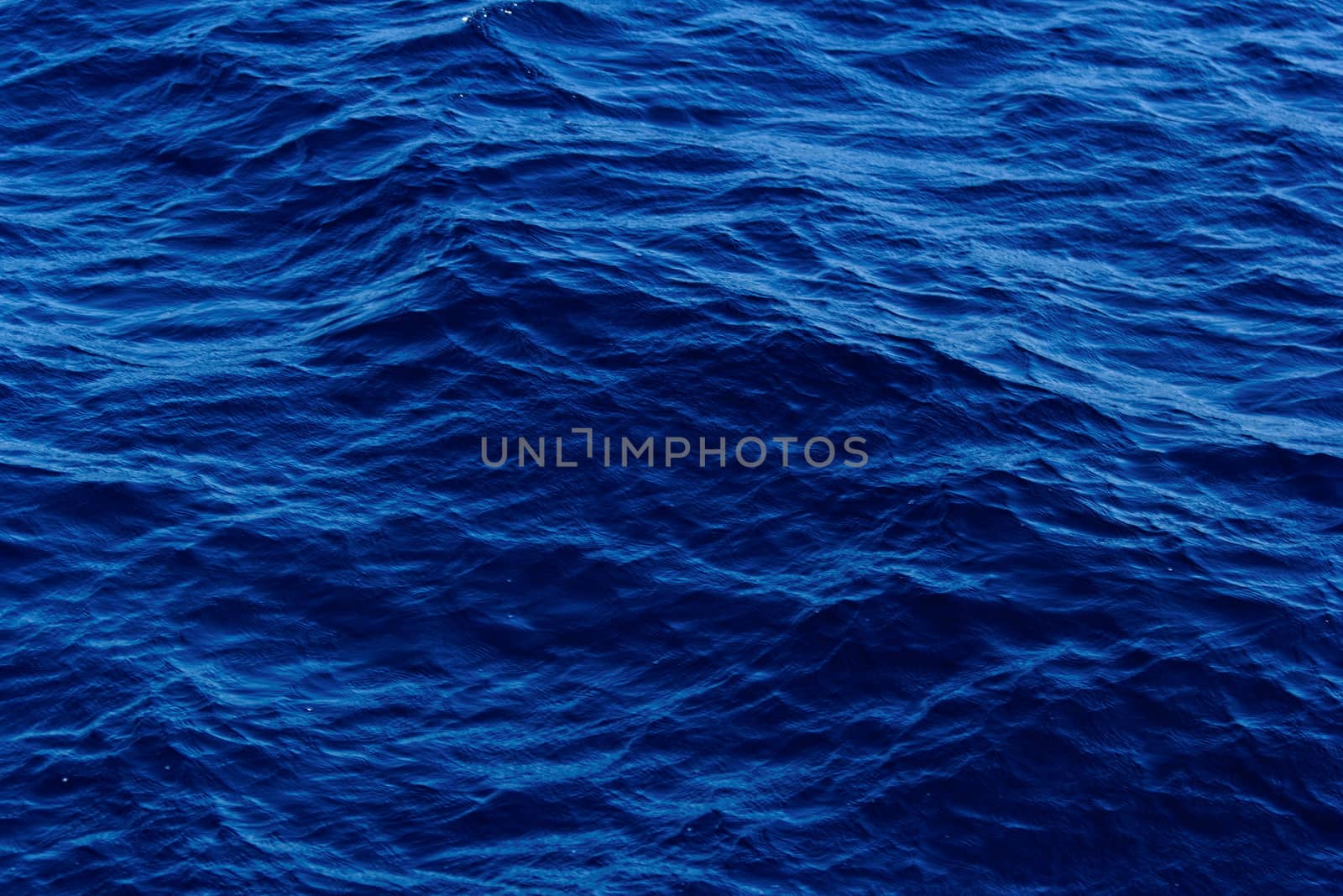 blue abstract background of wavy water surface by NagyDodo
