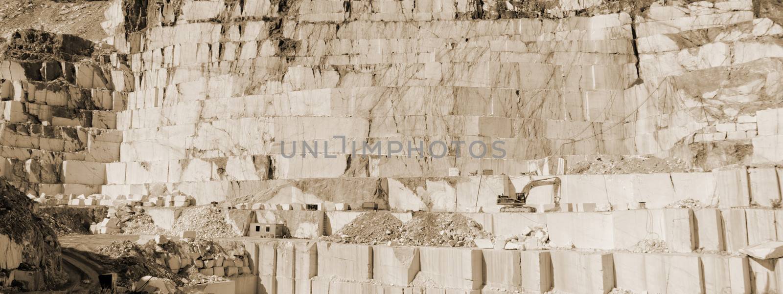 Detail of huge Thassos white marble quarry (mine) with grabber sepia