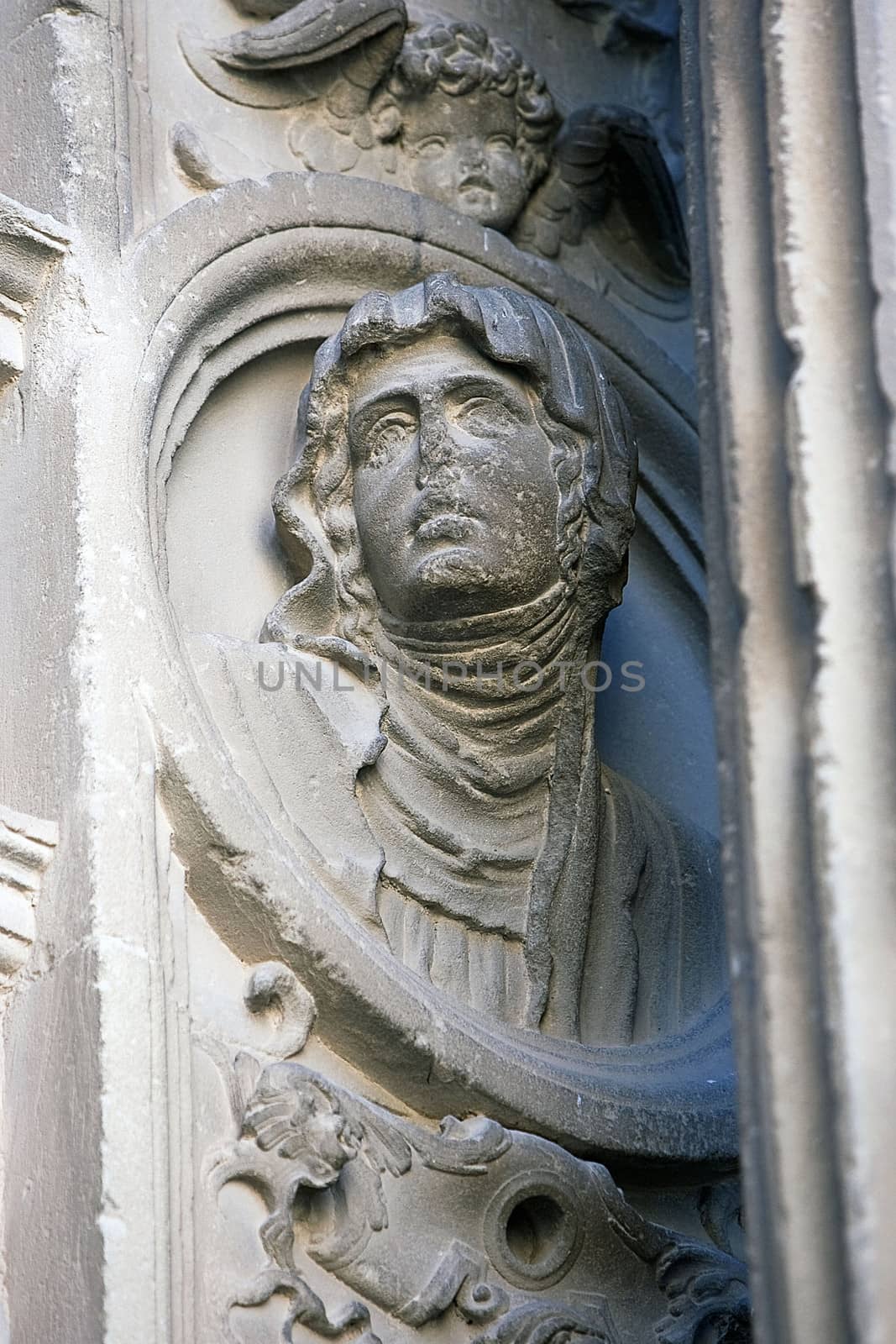 Tondo with woman's image in stone, relief of the Front of the chapel of El Salvador of Ubeda, Jaen province, Spain