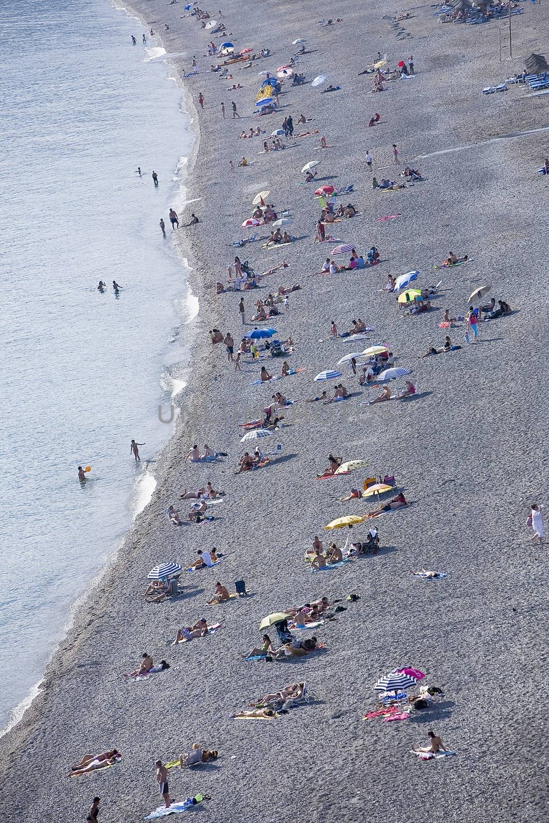 People enjoying the beach at Almunecar, Spain