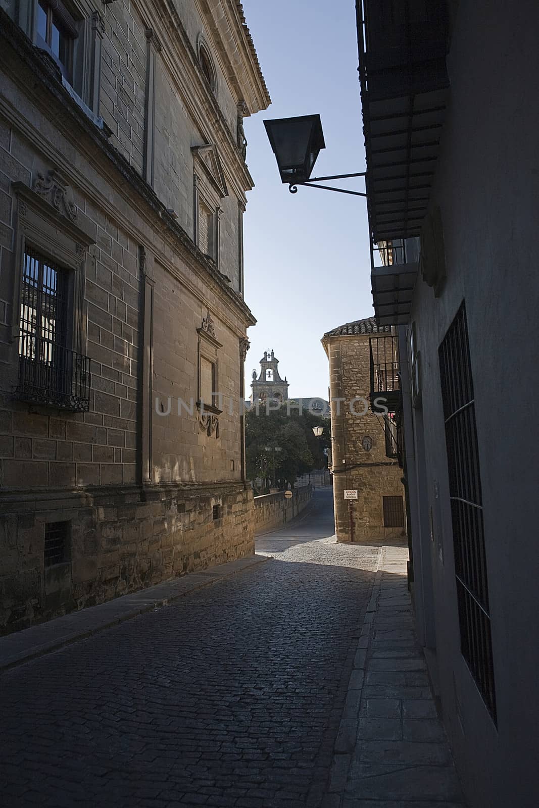 Real Street with bellfry at the background, paved street in historical center, Ubeda, Jaen province, Spain