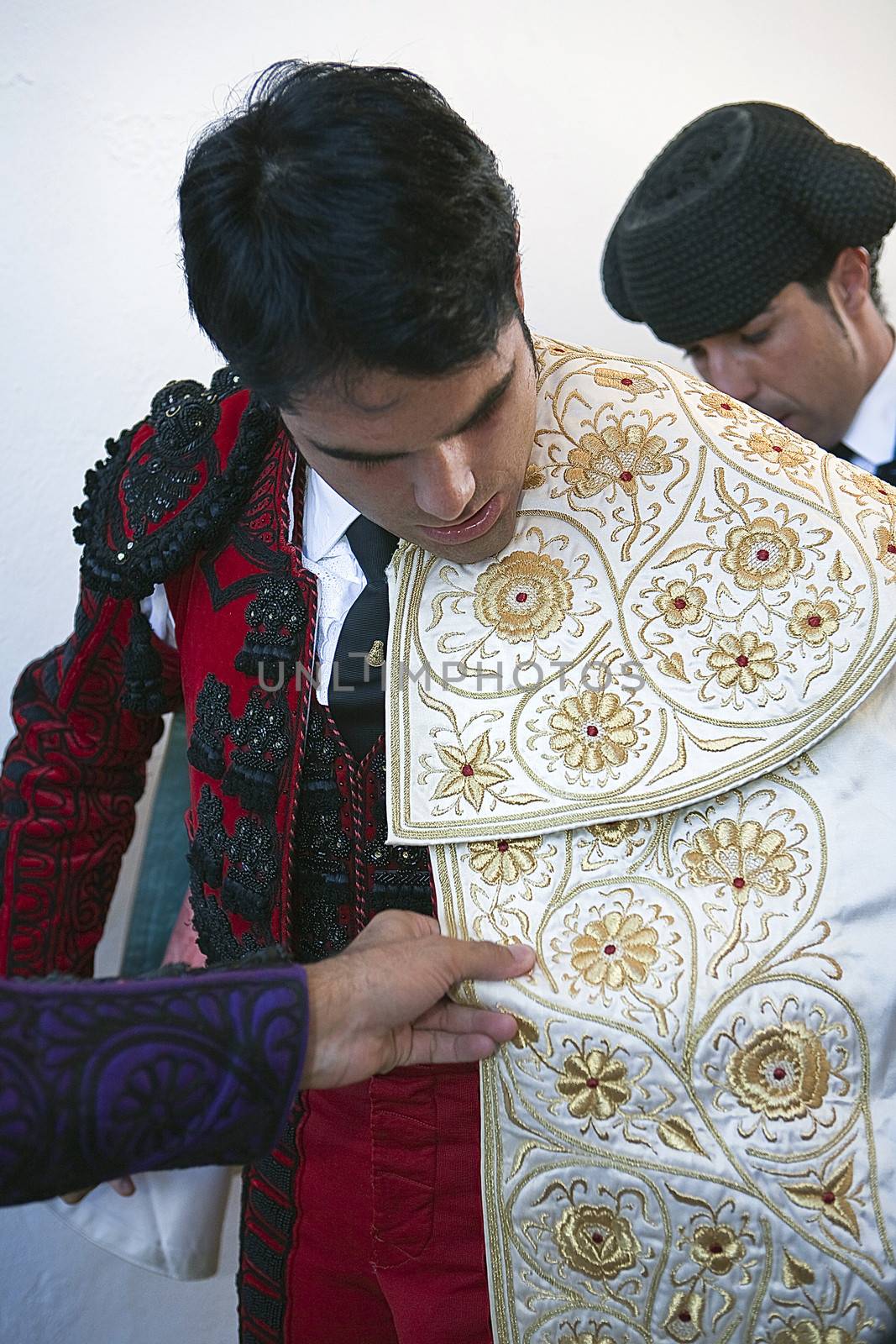 The spanish bullfighter Salvador Vega getting dressed for the paseillo or initial parade. Taken at Pozoblanco bullring before a bullfight, Pozoblanco, Cordoba province, Spain, 5 september 2010