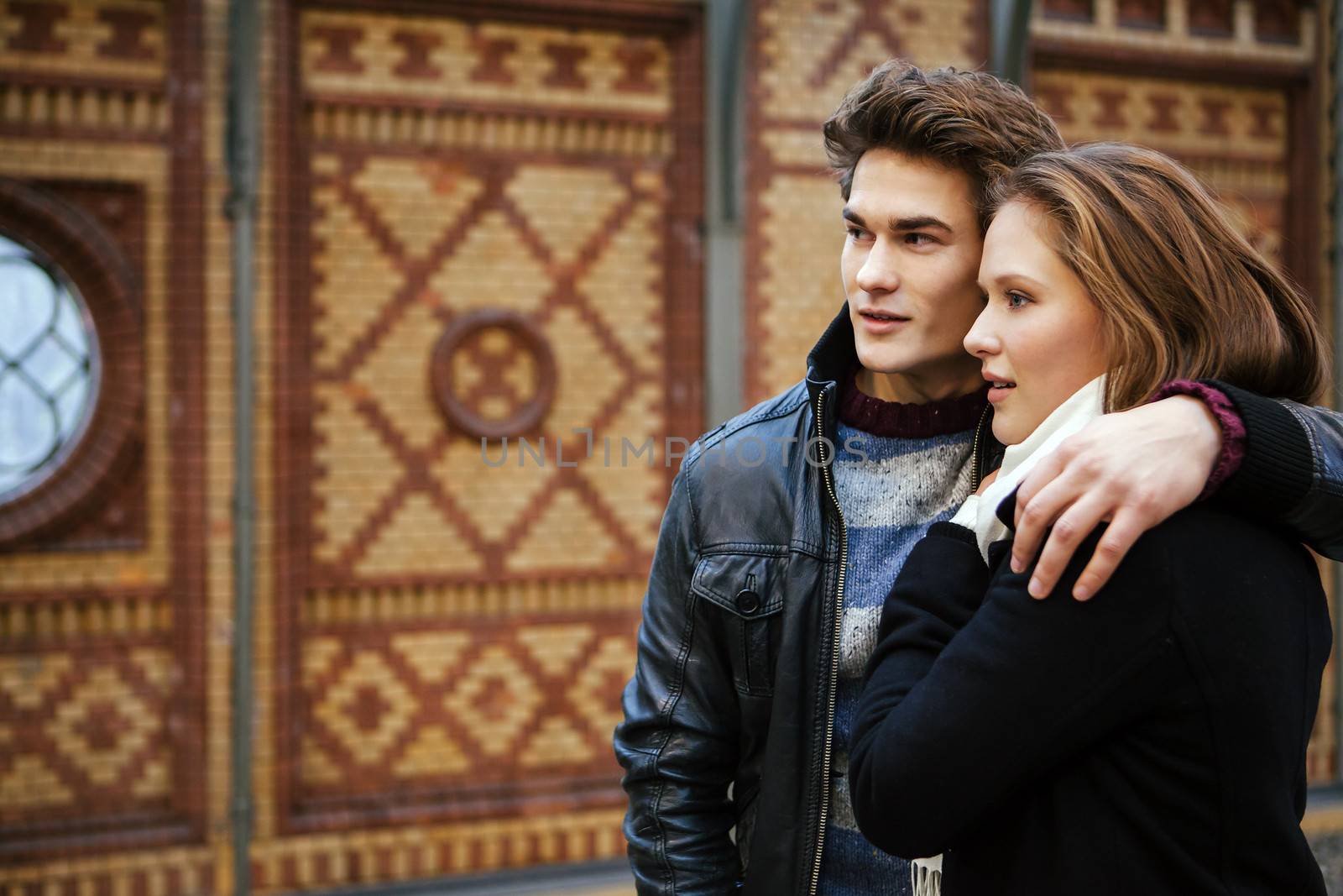 Photo of a happy couple waiting for a train. Photo is from the PhotoWalk in Berlin during Microstock Expo.