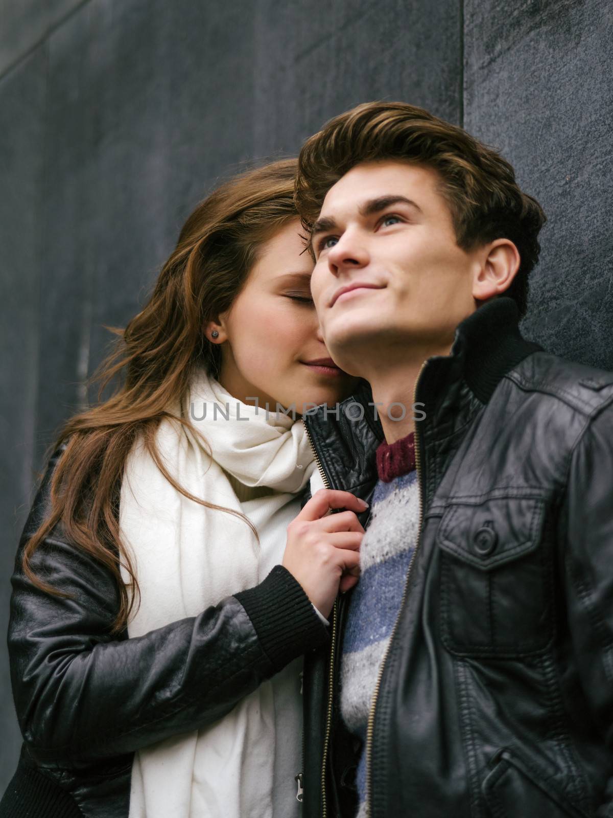 Photo of a happy couple in love outdoors during autumn.  Shallow depth of field with focus on the woman. Photo is from the PhotoWalk in Berlin during Microstock Expo.