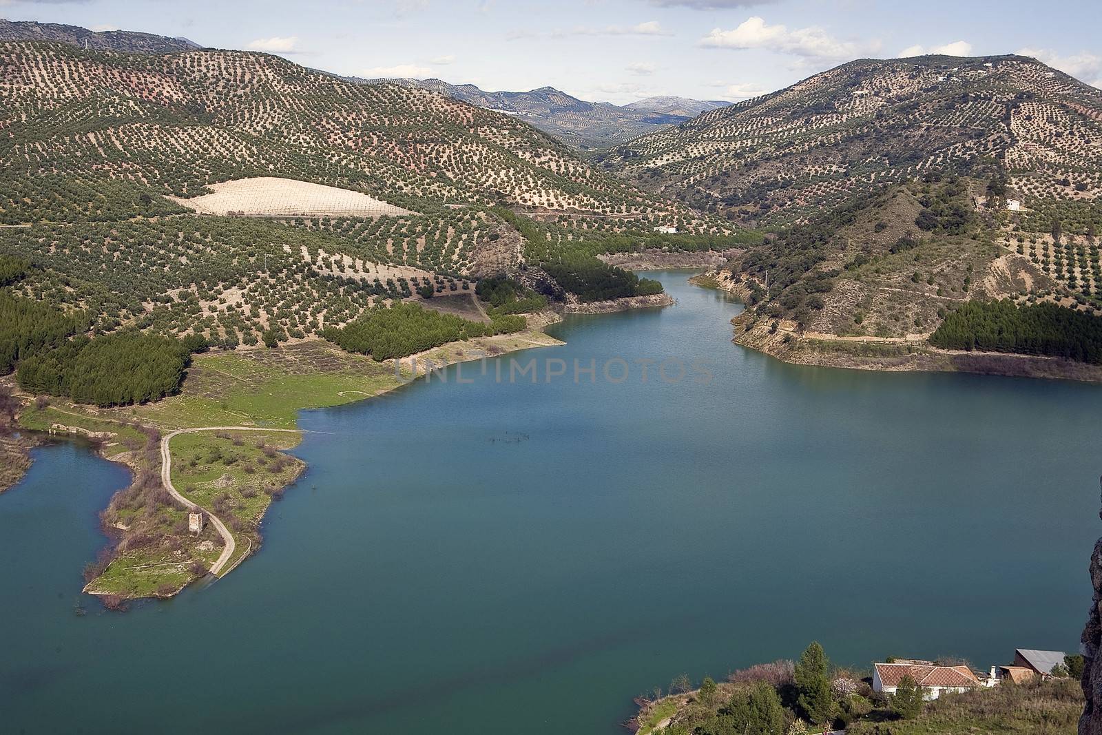 It was inaugurated on June 3, 1969, and belongs to the Guadalquivir hydrographic Confederation. The main tributary of the river Guadalquivir, the Genil, becomes Iznajar in the largest swamp in Andalusia.