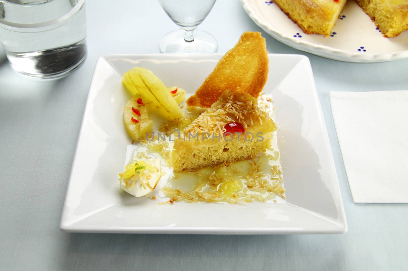 Fresh baked pineapple upside down cake with glace cherries.
