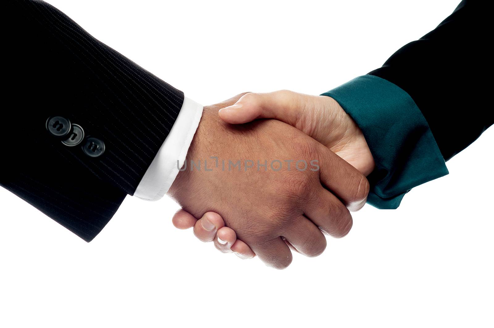 Businessmen shaking hands, closeup shot. by stockyimages