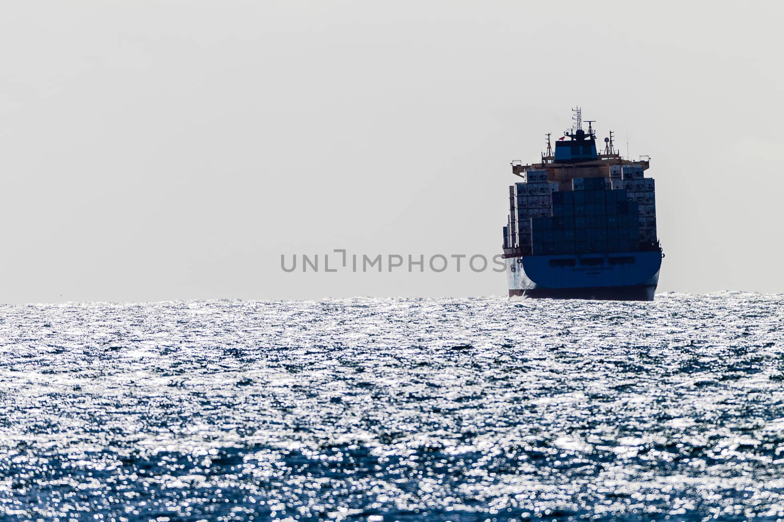 Container ship in high storm winds over the sea ocean.