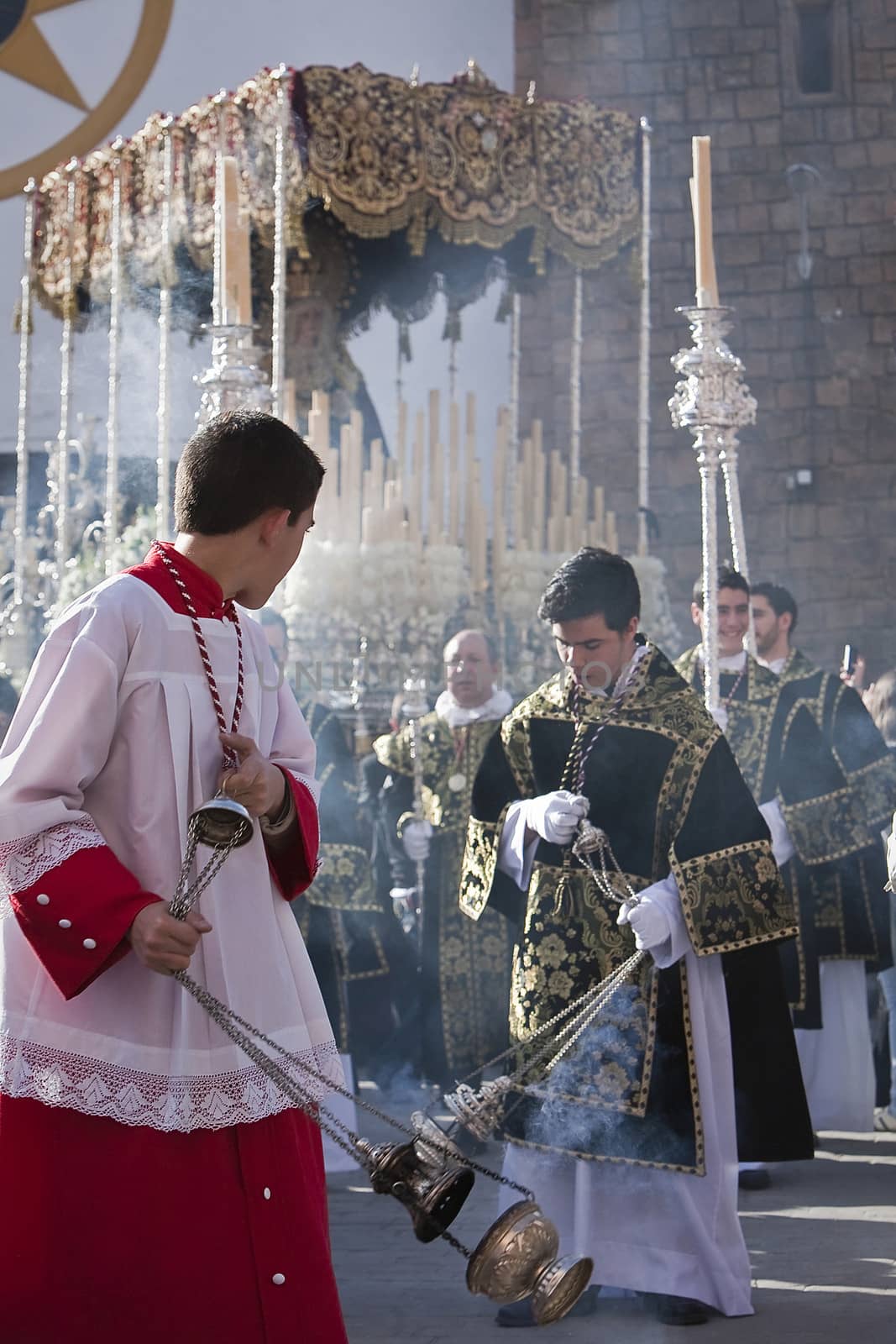 Young people in procession with incense burners in Holy week, Spain