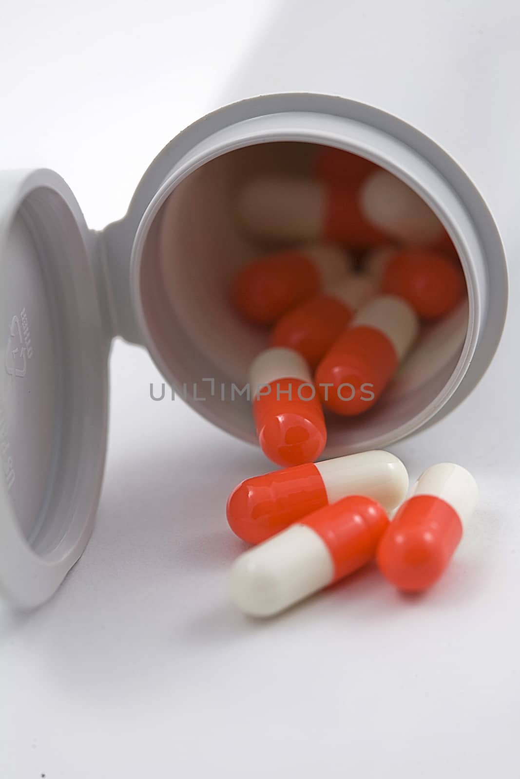 Contents of a plastic boat with  pills isolated on white background