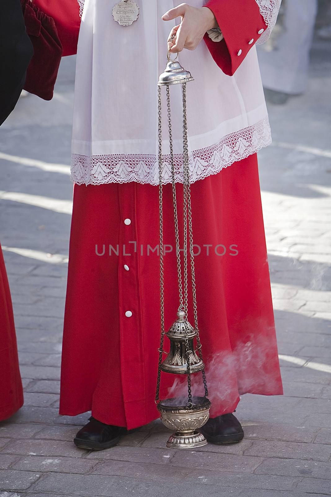 acolyte supports censer in a procession of Holy Week, Spain