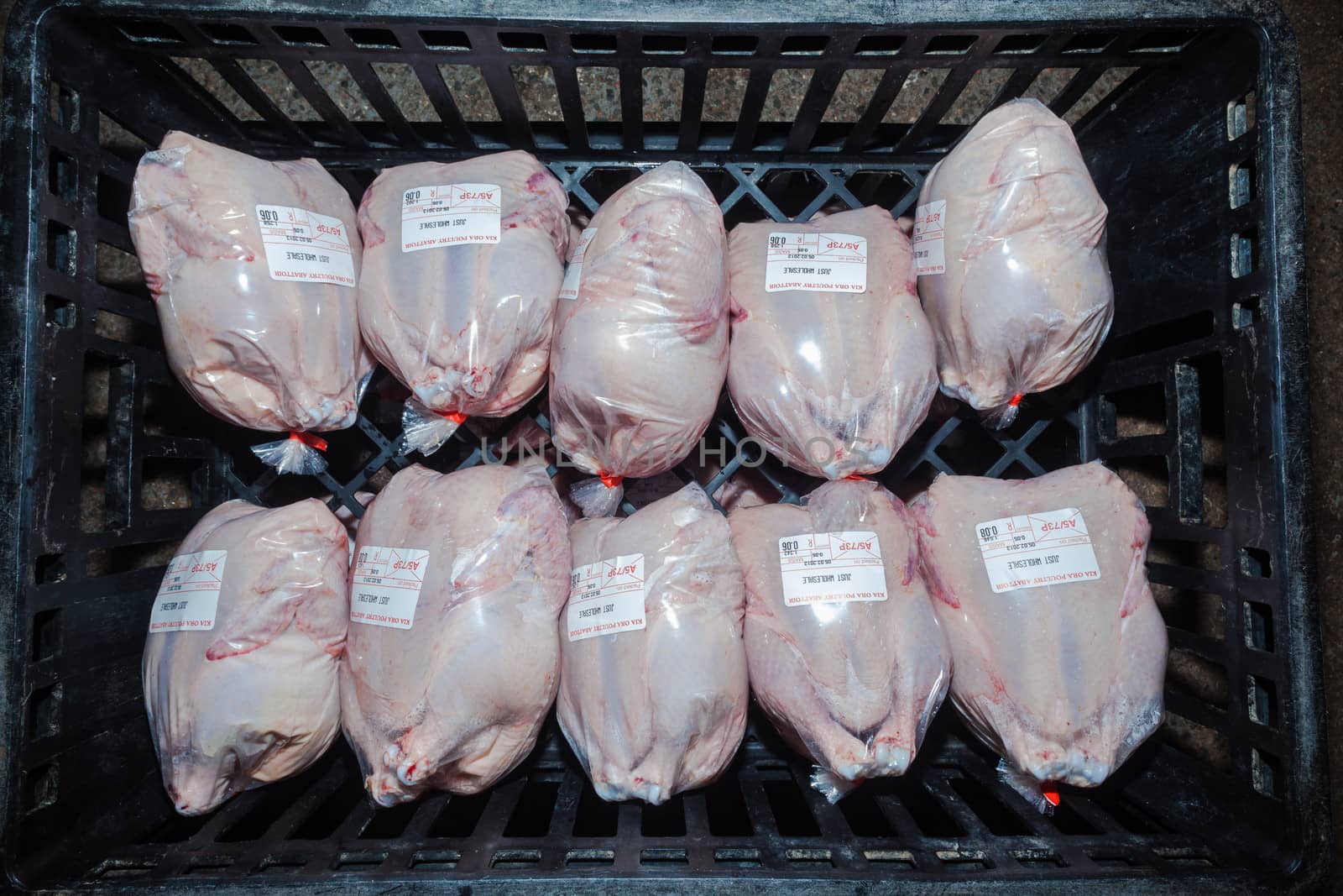 Poultry abattoir with crates of packed chicken carcasses for the food markets.