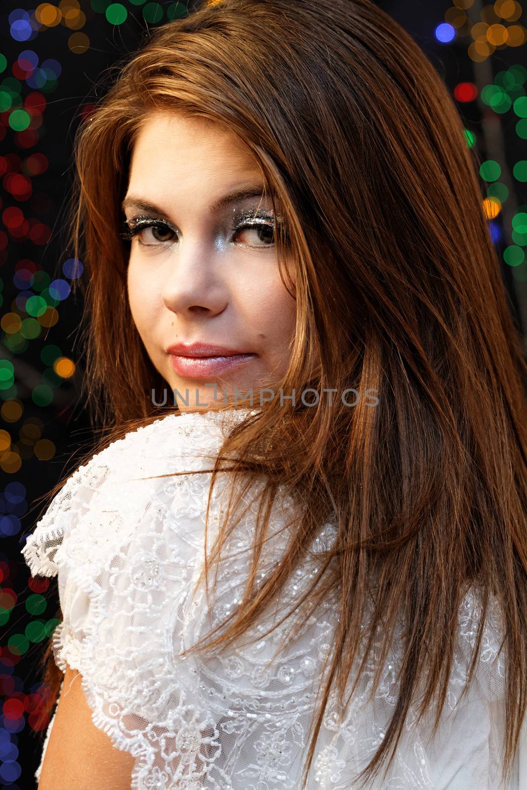 Friendly smiling young woman portrait studio shot