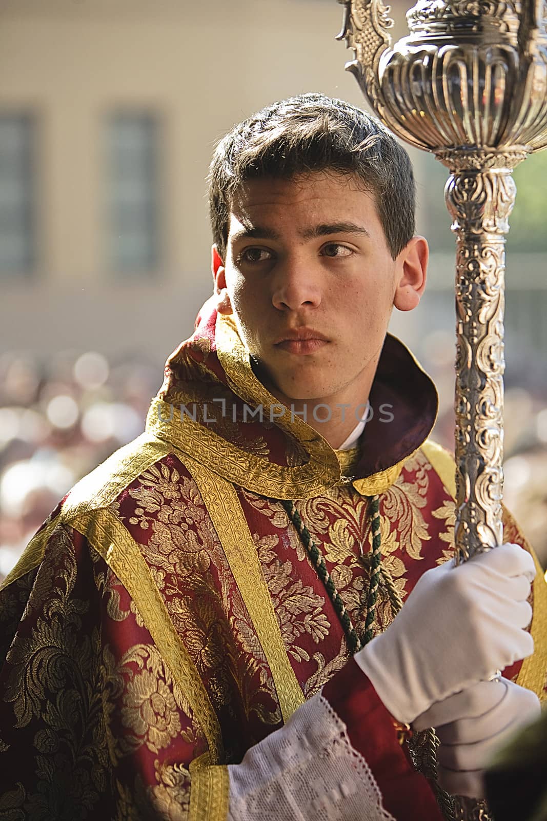Boy dressed in dalmatic in procession of holy week, Spain