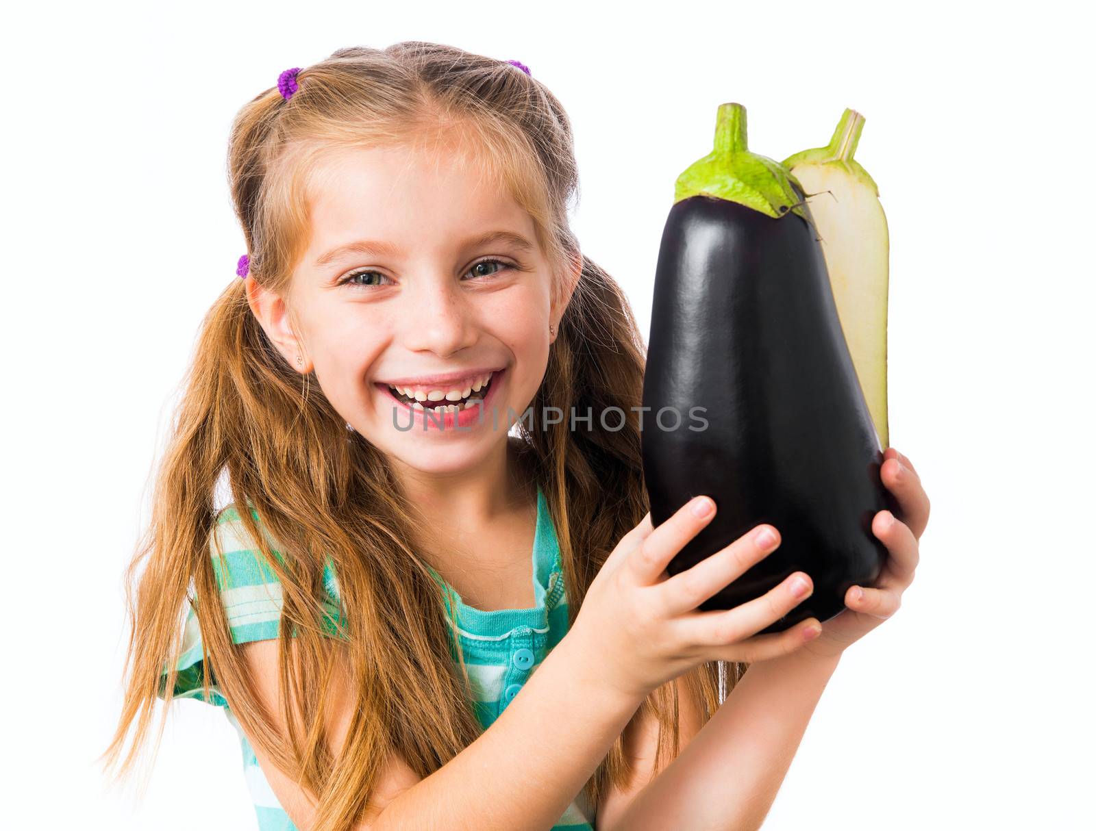 little girl with eggplant halves
