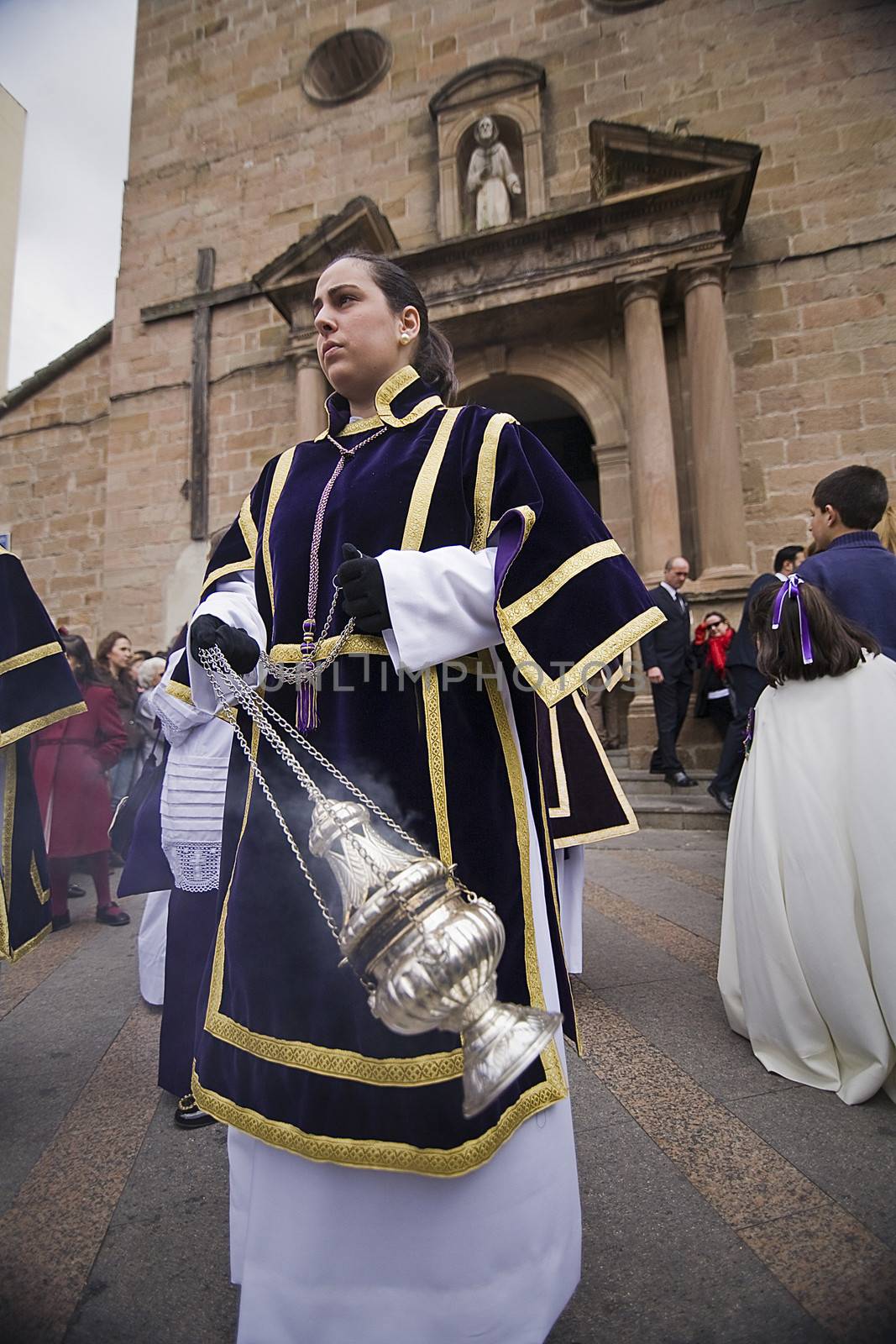 Young people in procession with incense burners in Holy week, Spain