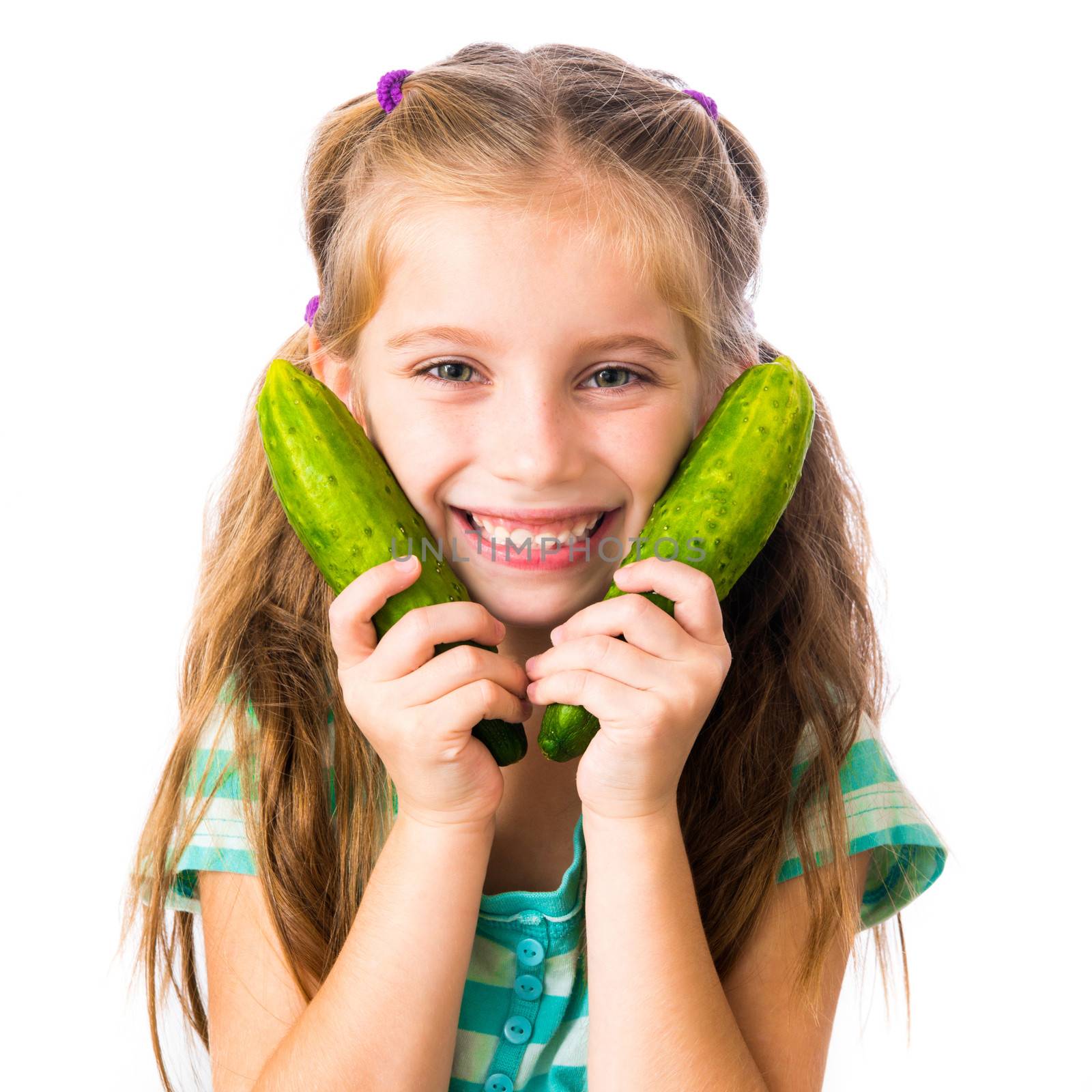little girl with two cucumbers isolated on white background