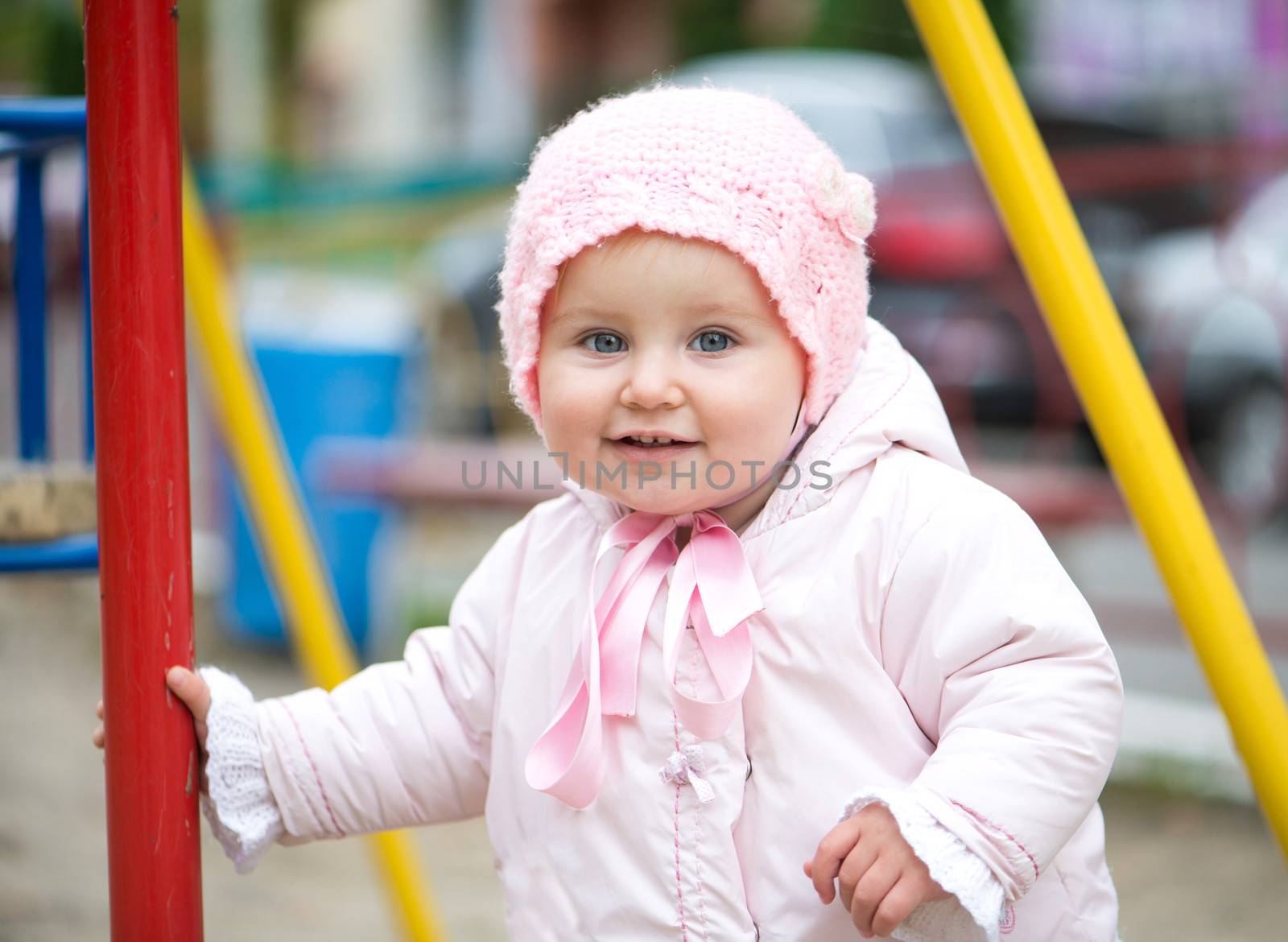 cute little baby girl on the playground