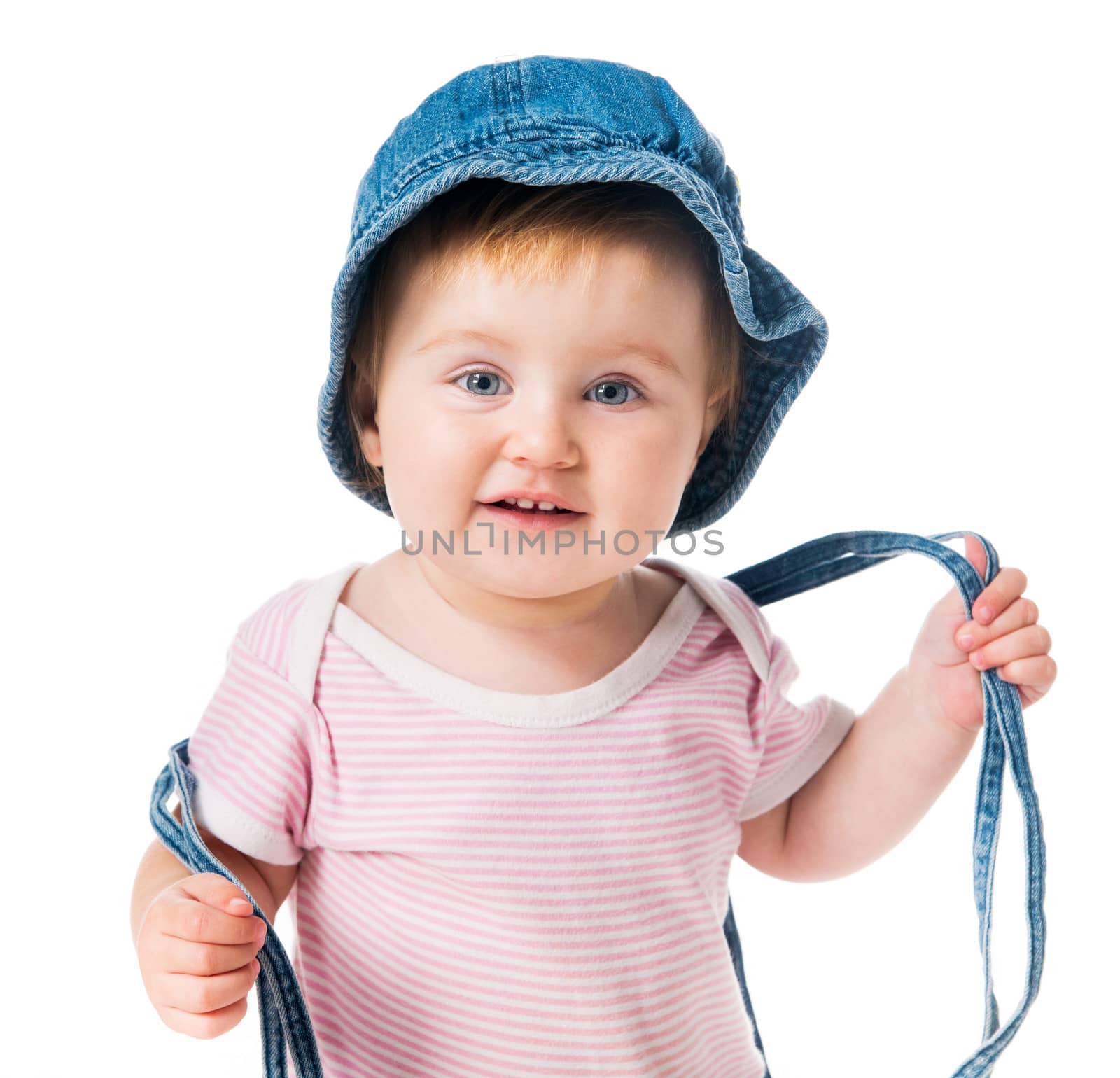 bright closeup portrait of adorable baby in denim cap