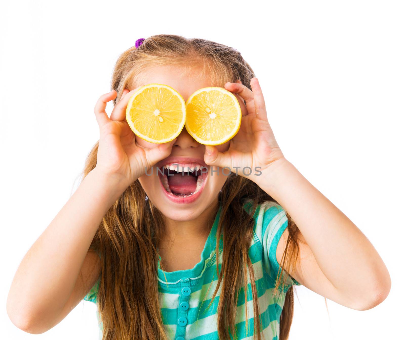 little girl with two halves of lemon as eyes isolated on a white background