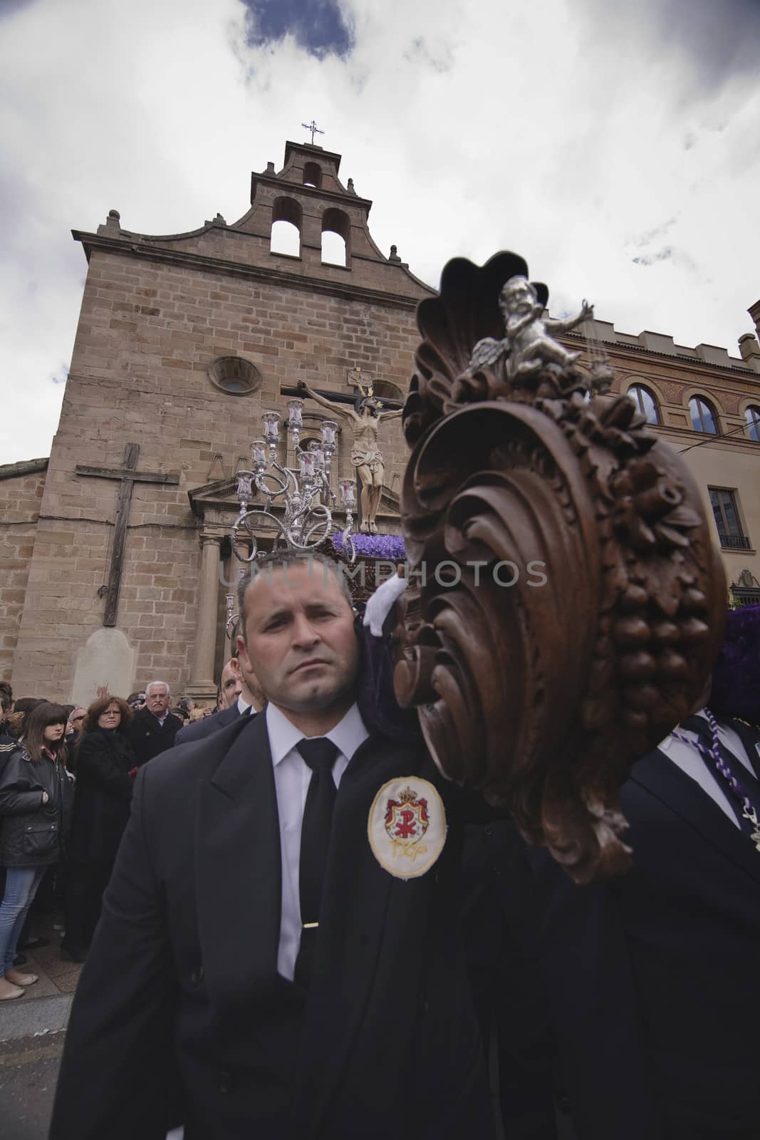 Leaving the Church of San Francisco of the brotherhood of the expiration of Christ ported by men with blue suit, Holy week in Linares, province Jaen, Andalusia, Spain