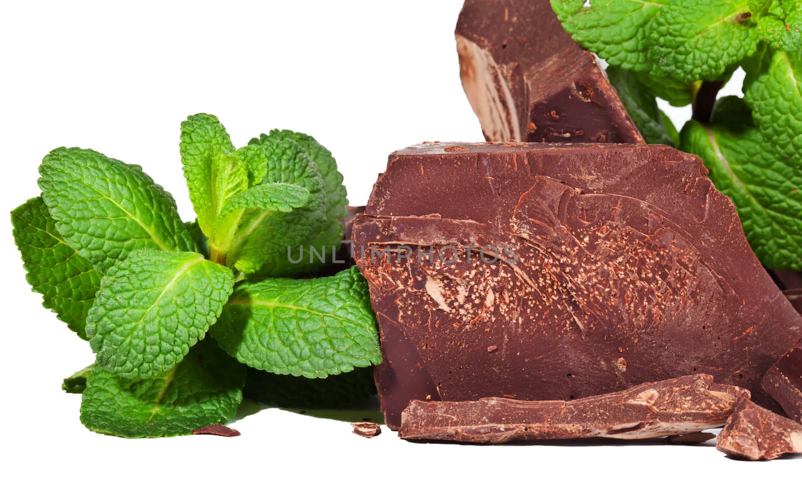 Heap of delicious black chocolate with mint closeup