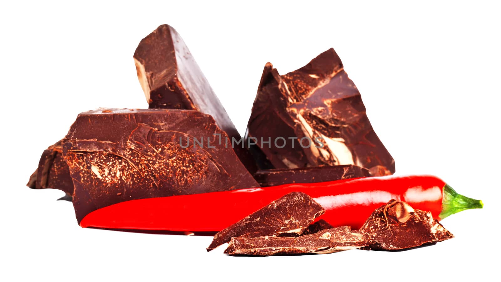 Heap of delicious black chocolate with red chili pepper by RawGroup