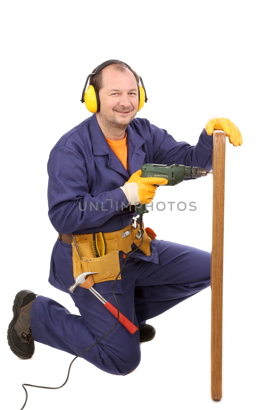 Worker in ear muffs with drill and board. Isolated on a white backgropund.