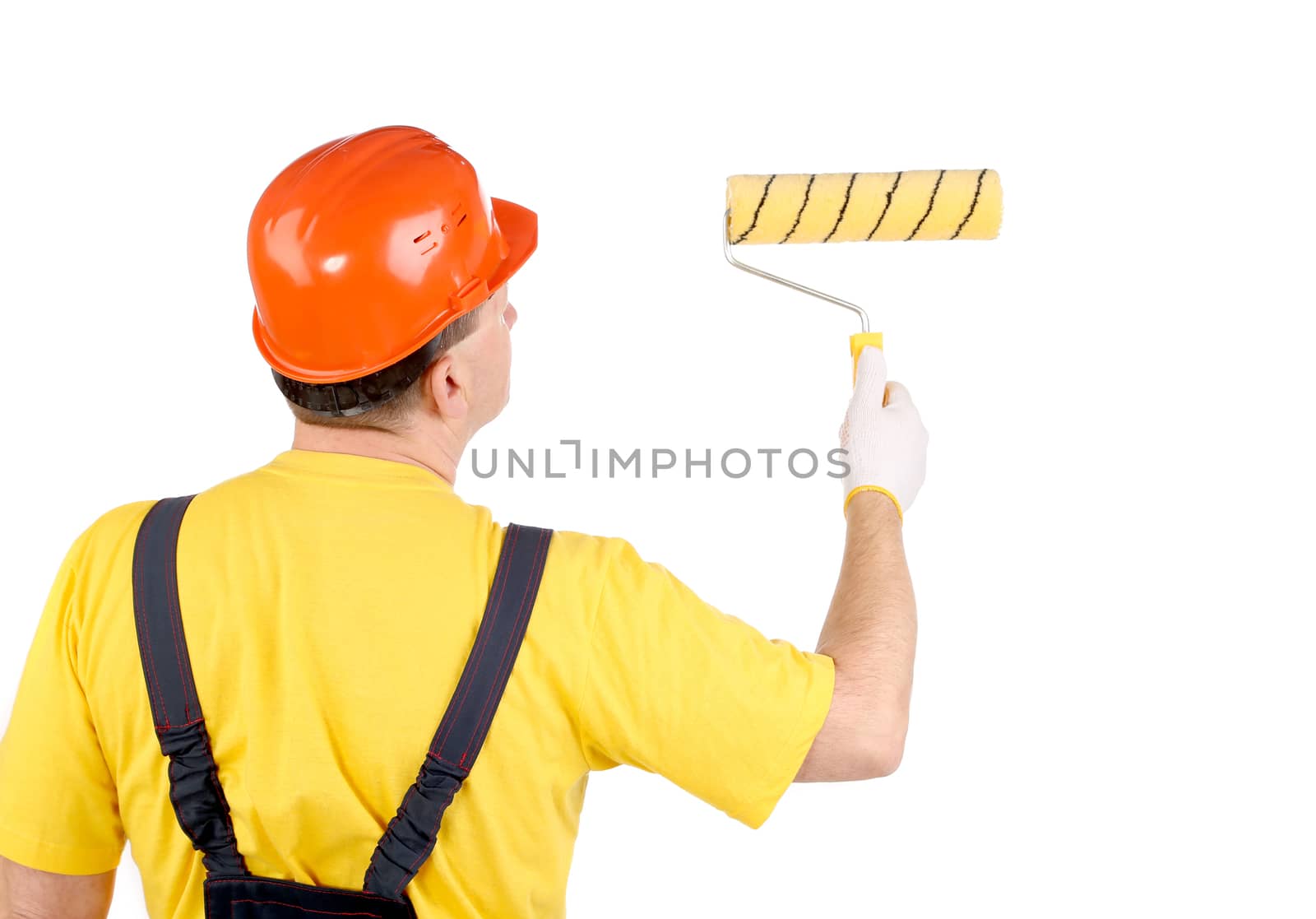 Worker in hard hat working with roller. Isolated on a white backgropund.