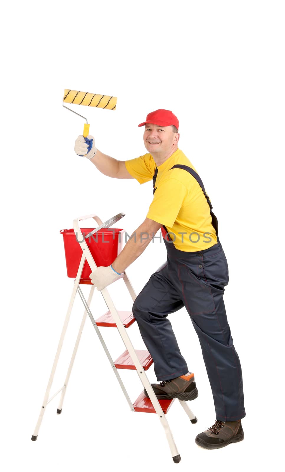 Worker on ladder with roller and bucket. Isolated on a white backgropund.