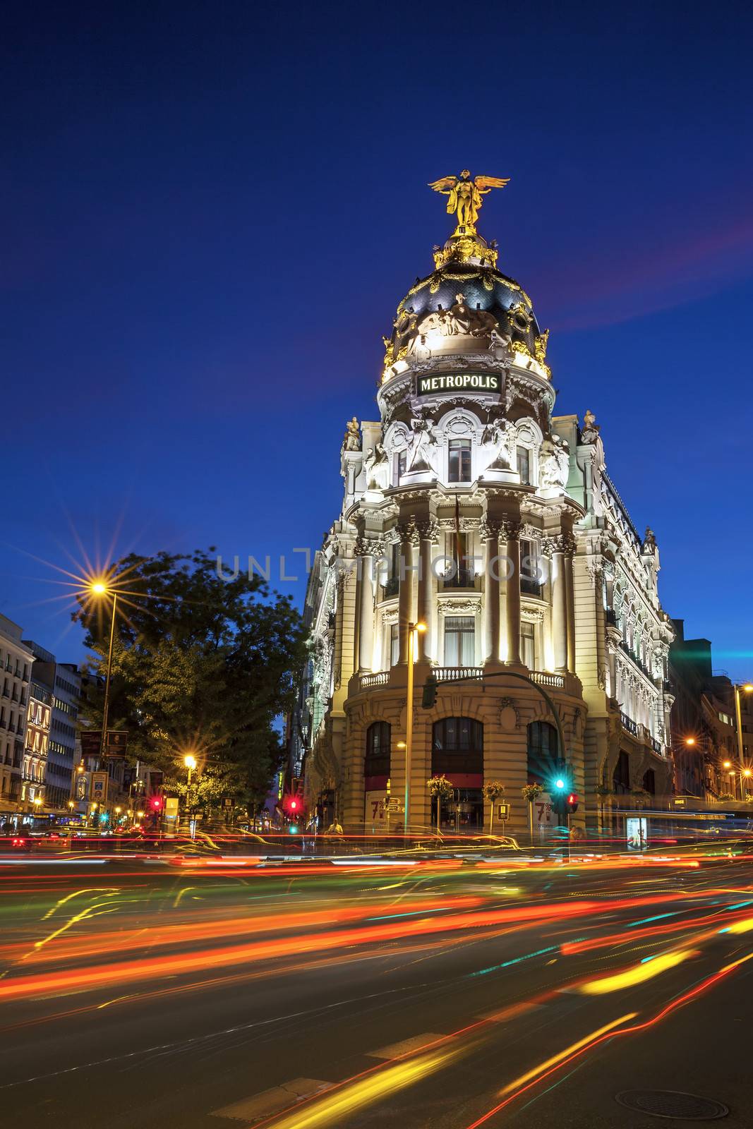 Rays of traffic lights on Gran via in Madrid at night. Spain, Europe.