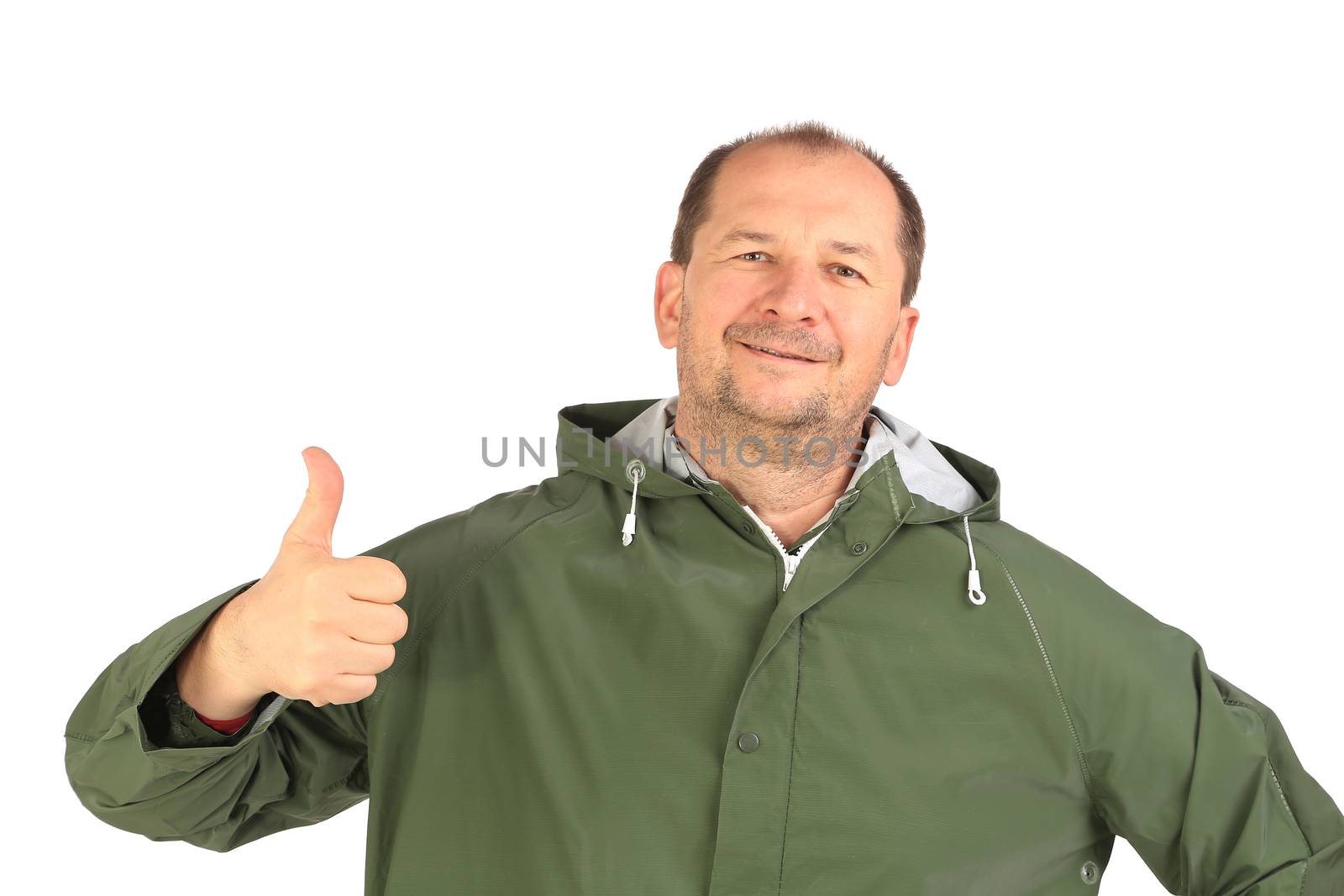 Man in coat shows thumb up. Isolated on a white background.