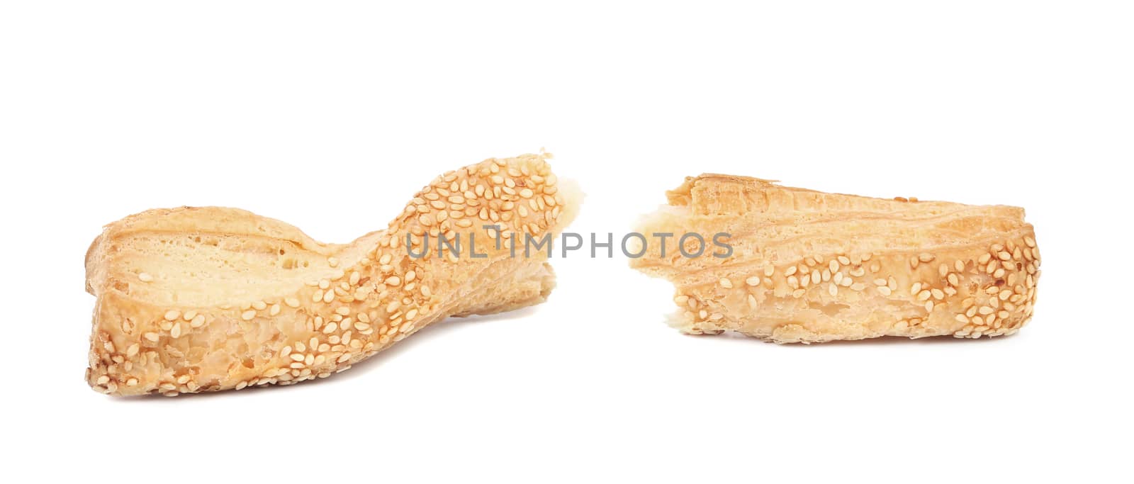 Broken cheese stick with seeds. Isolated on a white background