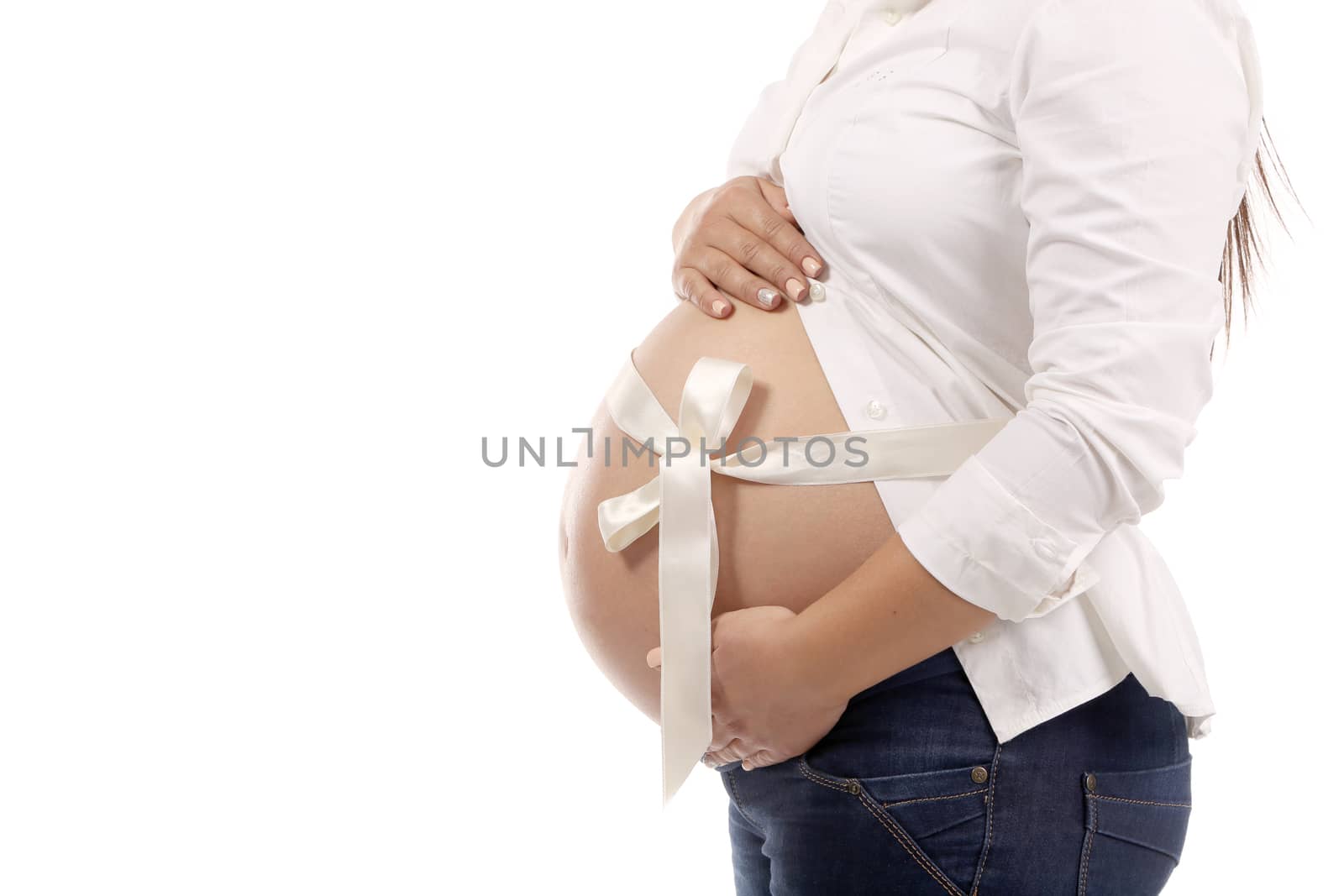 Belly of pregnant woman. There is space for text