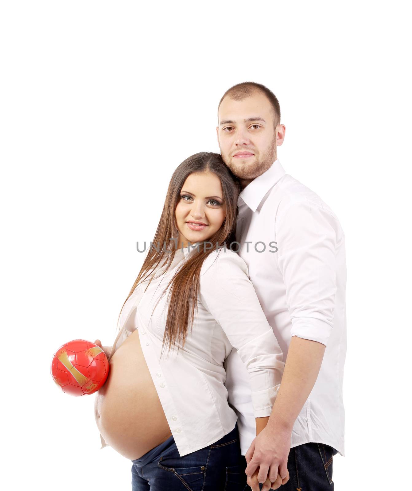 Beautiful couple expecting a baby. Red ball