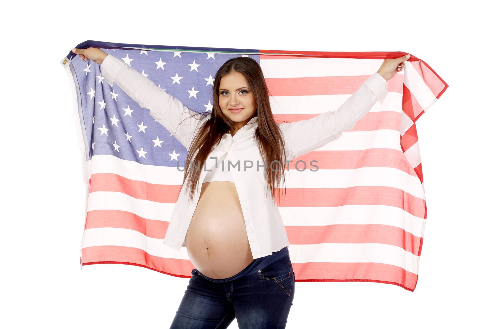 Pregnant woman with american flag hanging from her hands