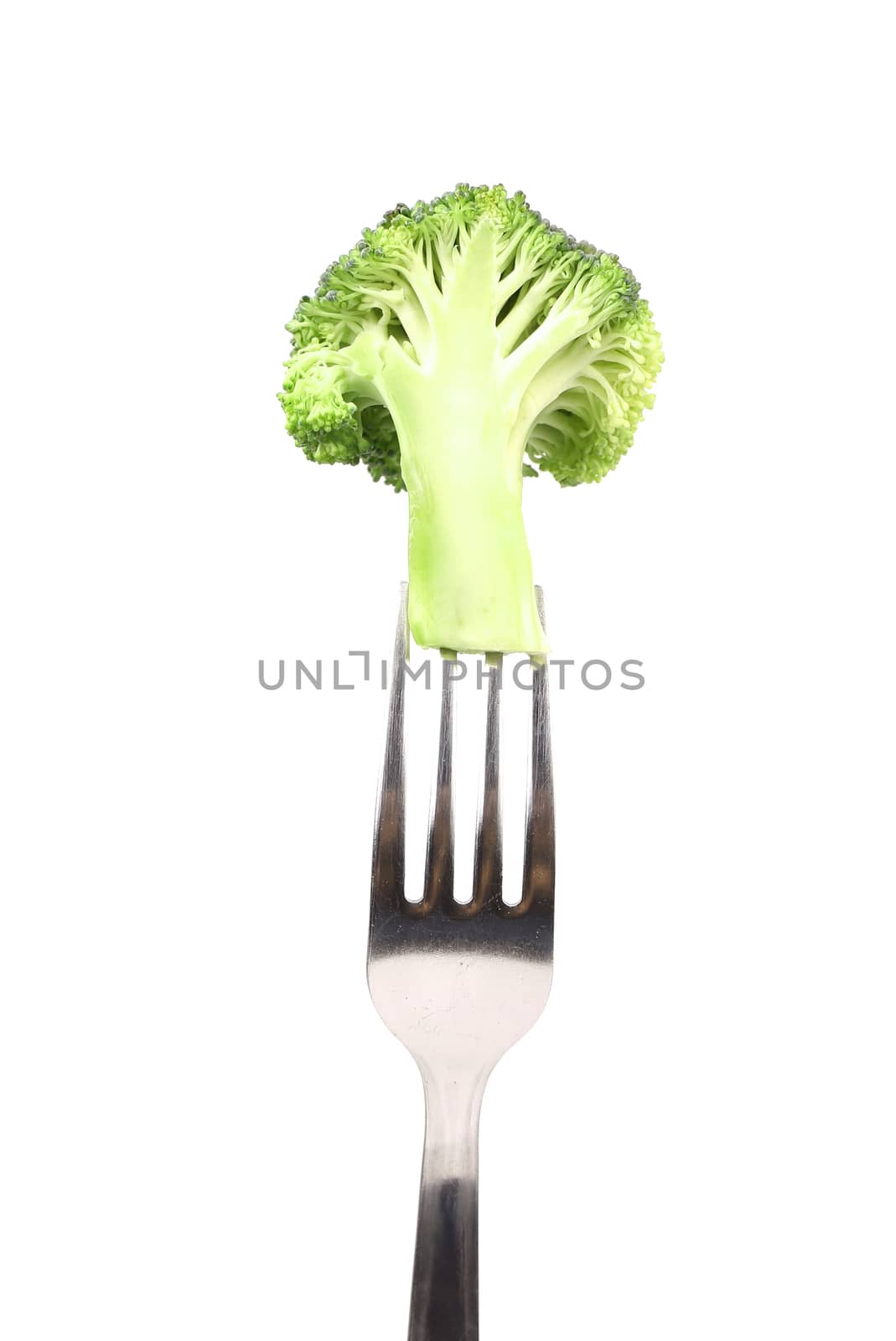 Fresh broccoli on a fork. Isolated on a white background