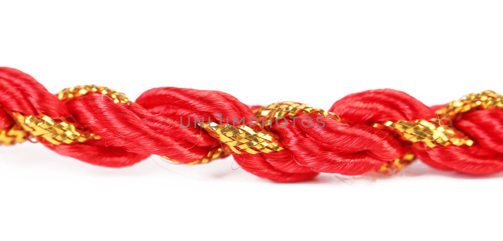 Red and gold gift wrapping cord. Isolated on a white background