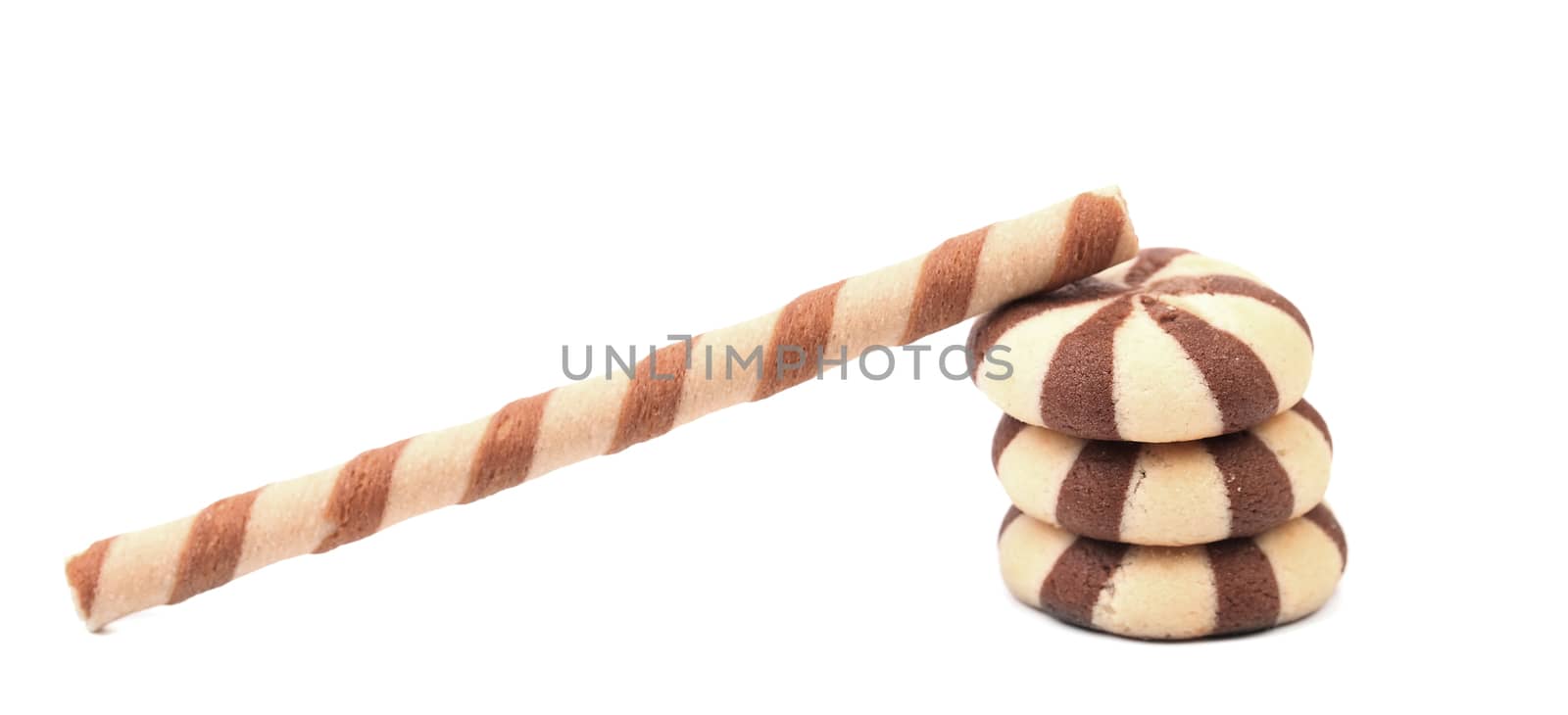 Chocolate swafer rolls and stake biscuits. Isolated on a white background.