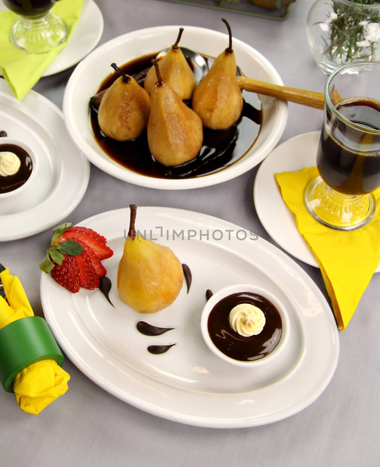 Delicious poached pears in chocolate syrup ready to serve.