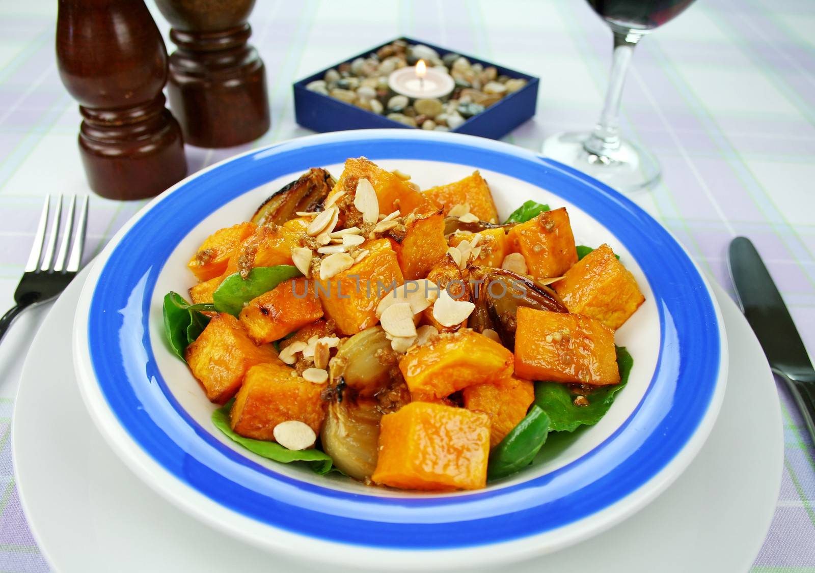 Roasted pumpkin and onion salad with wilted spinach and toasted almonds.