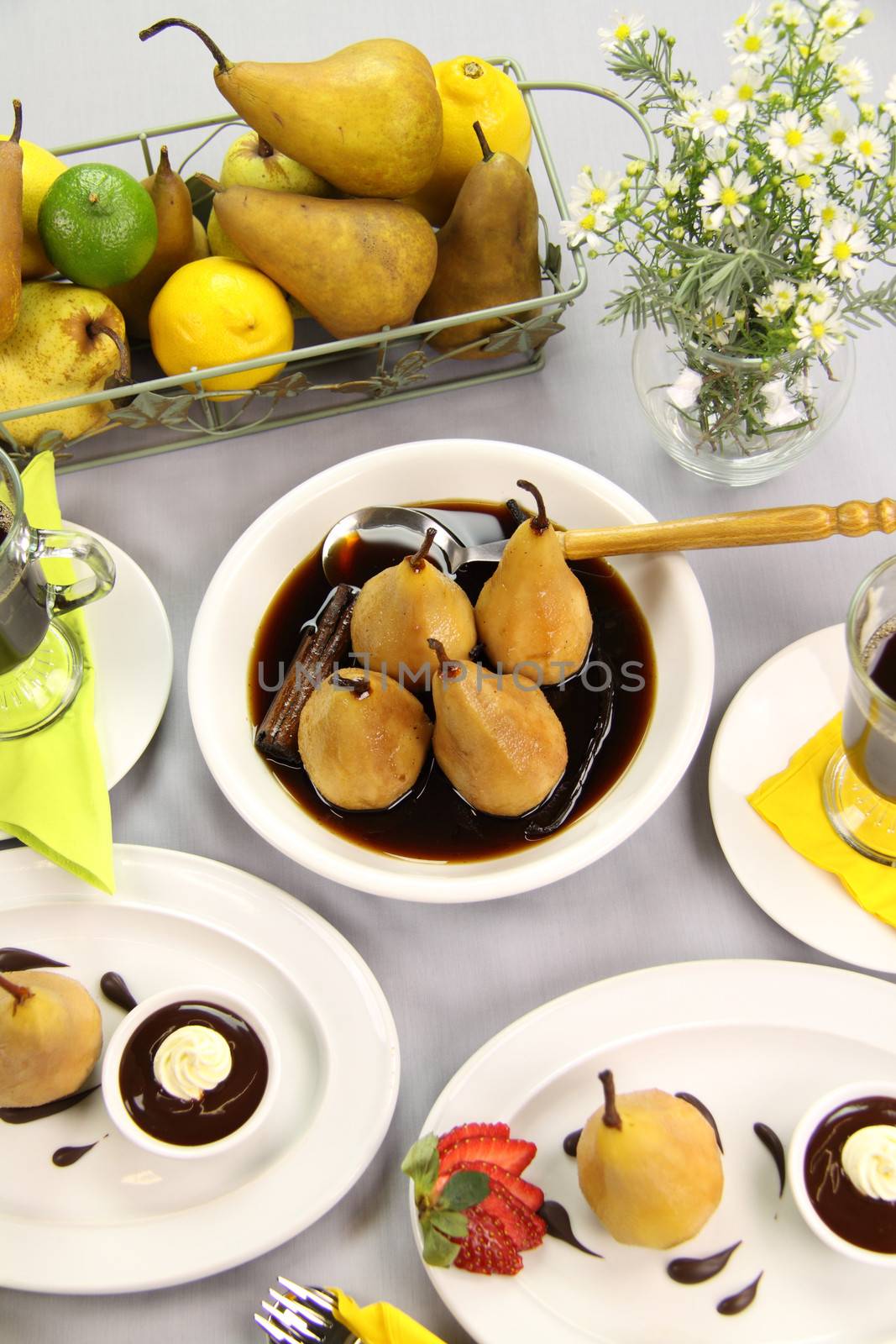Delicious poached pears in chocolate syrup ready to serve.