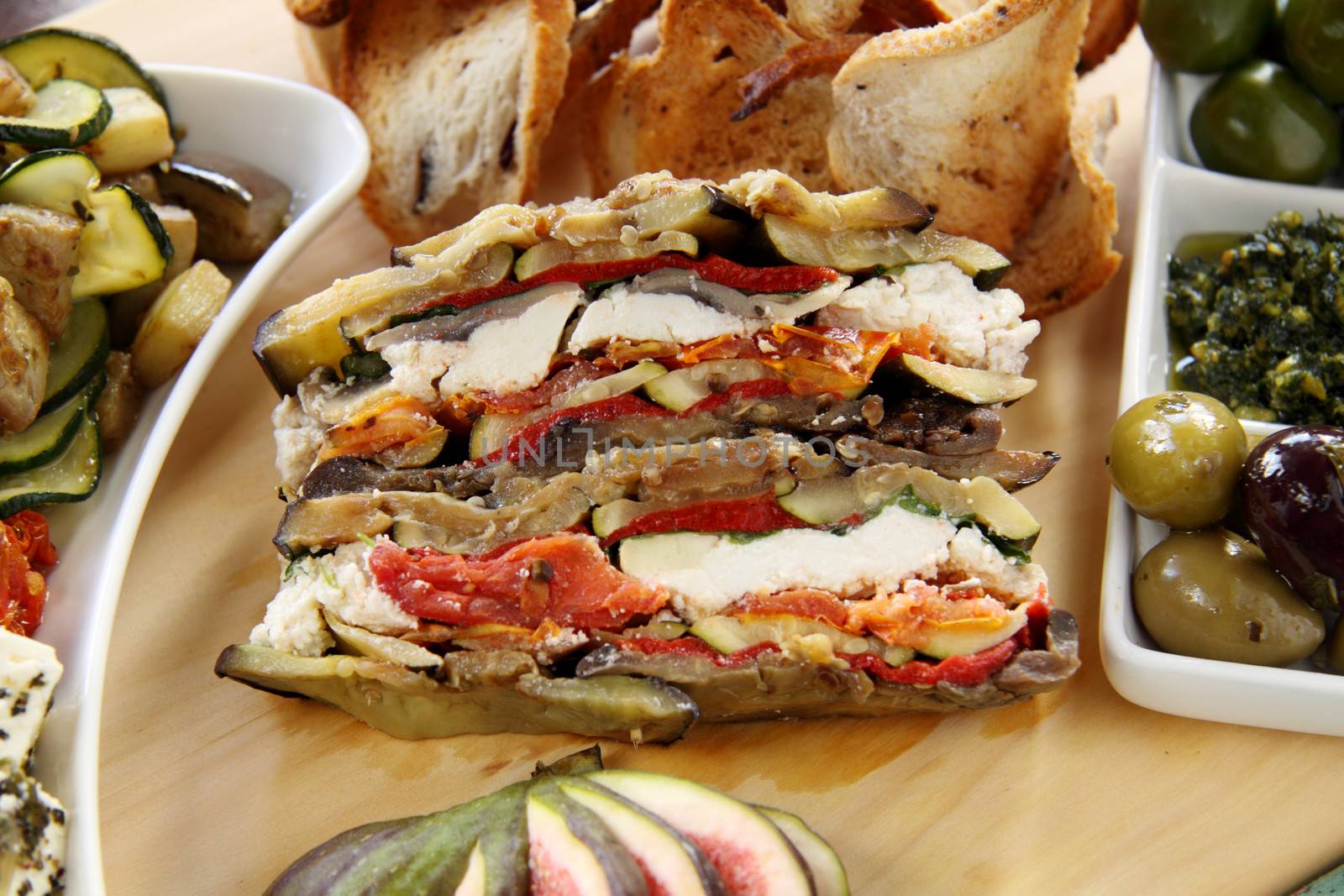 Delightful rustic vegetarian stack with assorted vegetables and toasty bread.