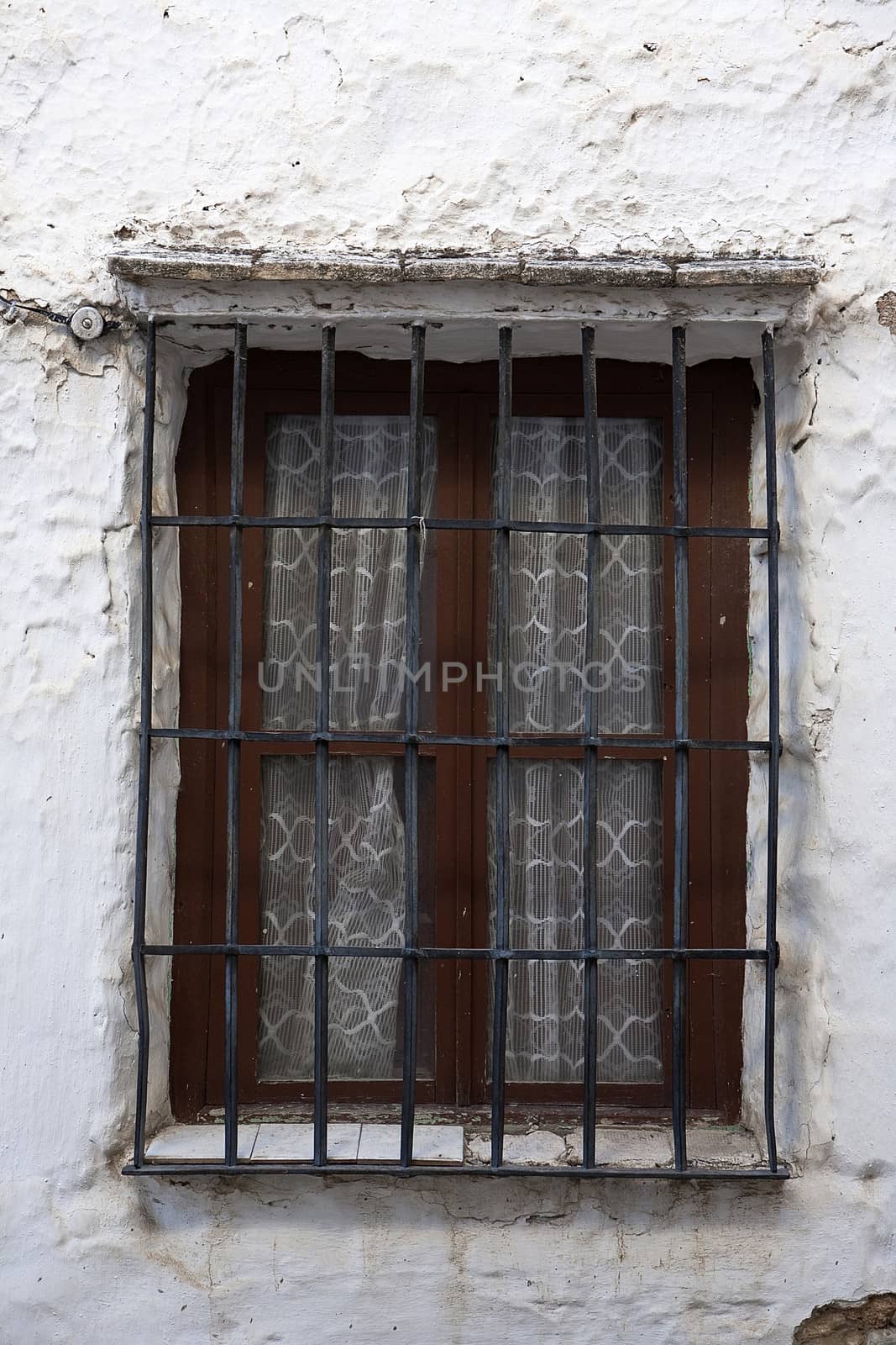Ancient window in a wall, Andalusia, Spain