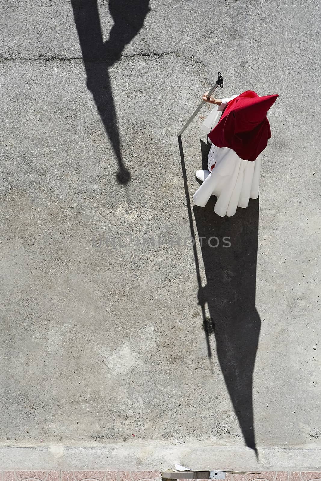 Aerial view of a penitent in a procession of holy week on Palm Sunday, Andalucia, Spain