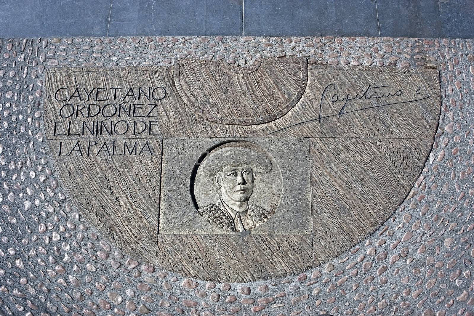 Engraving above cement in honor of the Spanish Bullfighter Cayetano Ordoñez y Aguilera, known as El Niño de la Palma, near the bullring of Ronda, Malaga Province, Andalucia, Spain